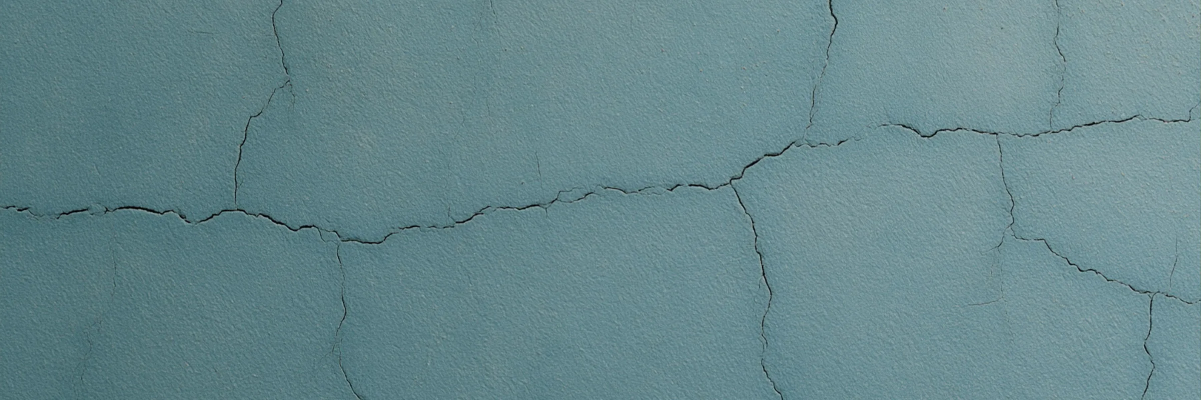A building exterior wall facade, representative of the surfaces treated in exterior wall waterproofing