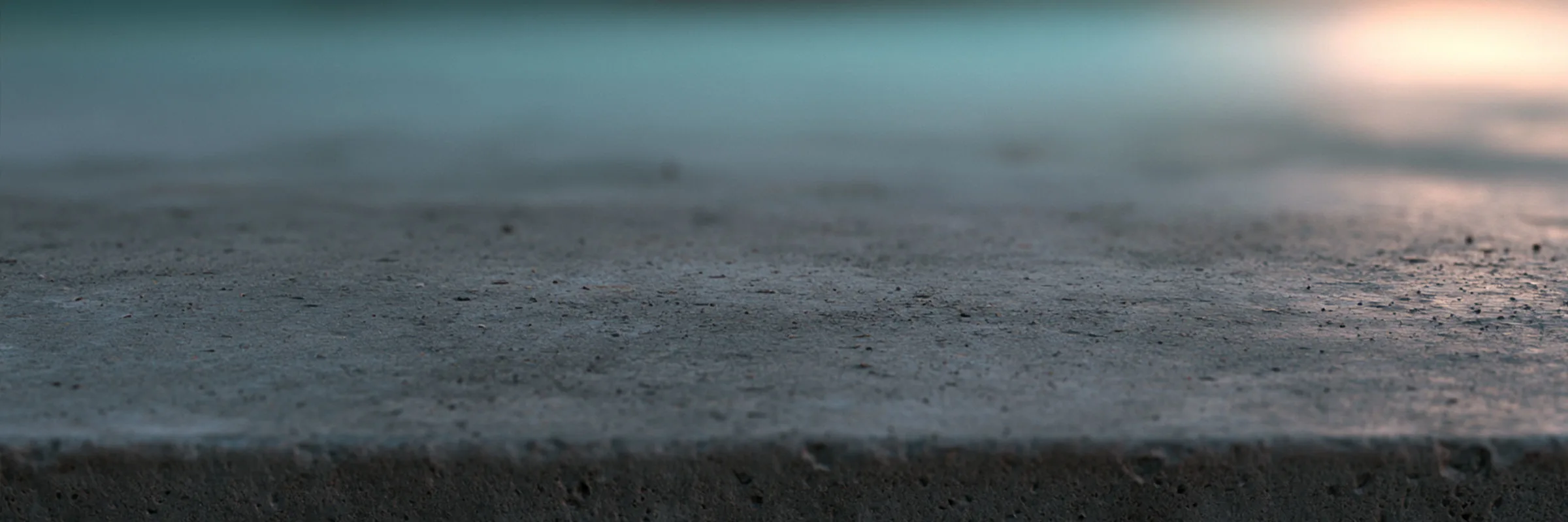 A concrete substrate, representative of the material crystalline waterproofing chemically integrates with