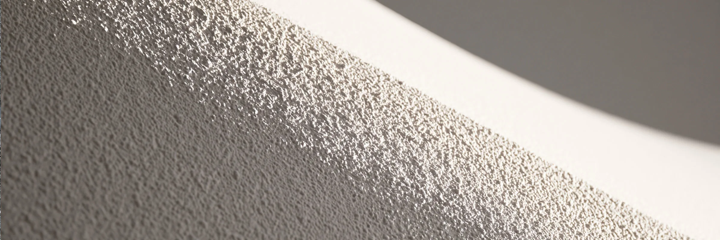 An exterior wall surface, representative of the surfaces treated with elastomeric coatings