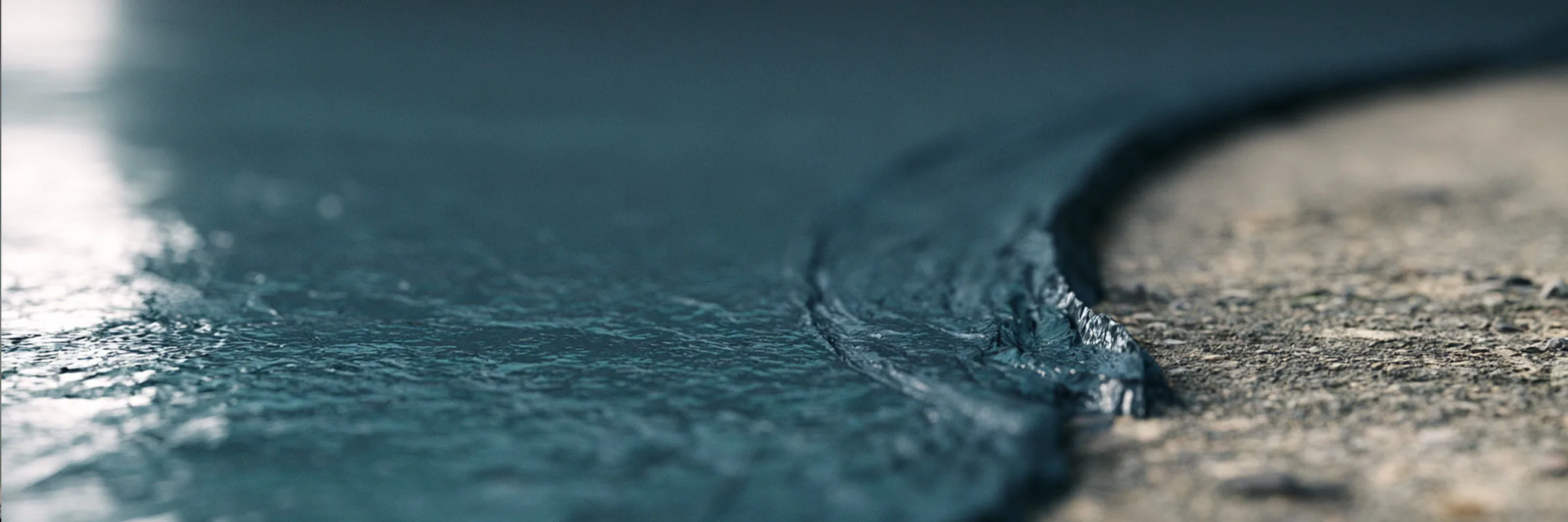 An exposed terrace surface, representative of the seamless coverage liquid-applied membranes provide